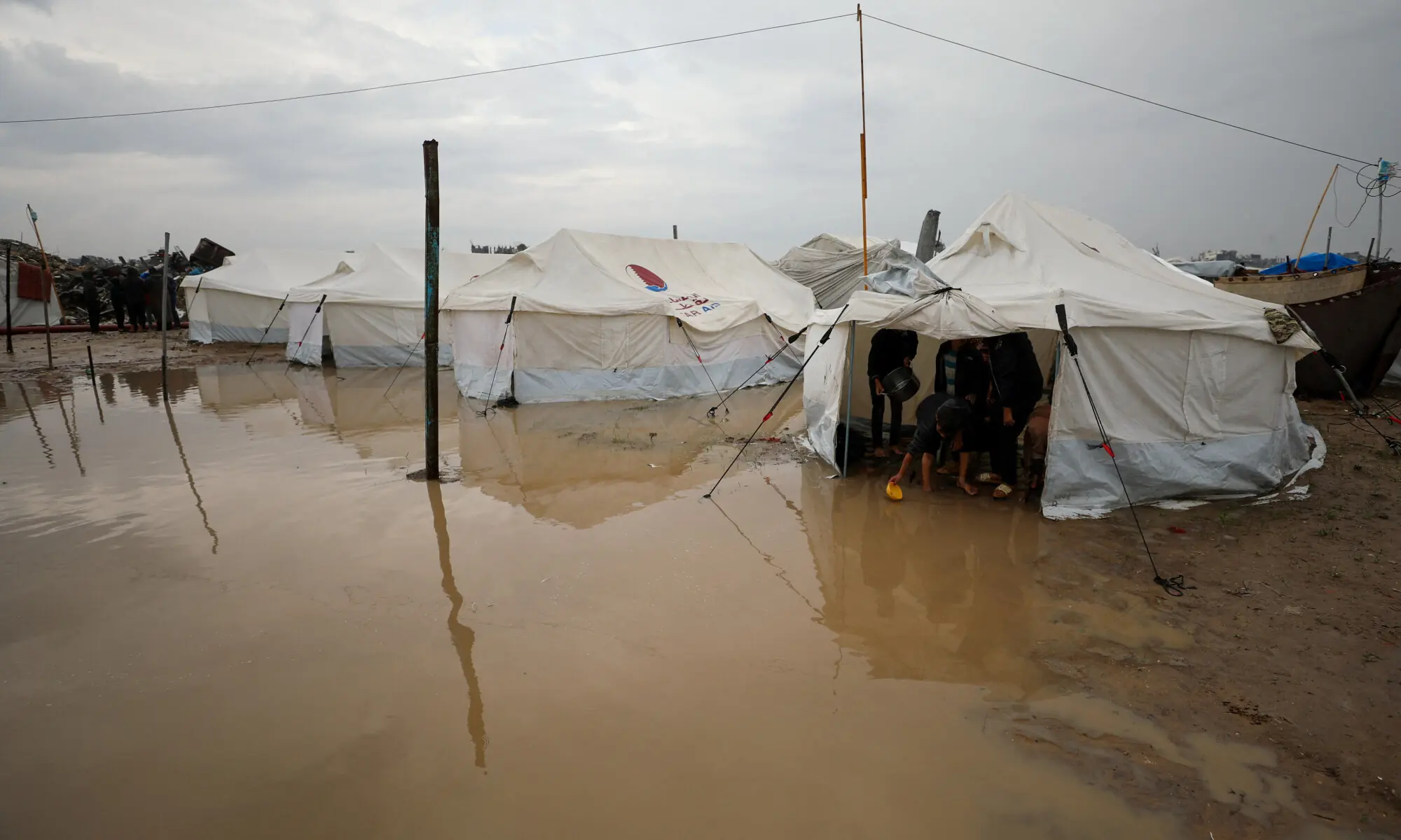 Displaced Palestinians shelter in a tent camp on a rainy day in Gaza City.&mdash;Reuters