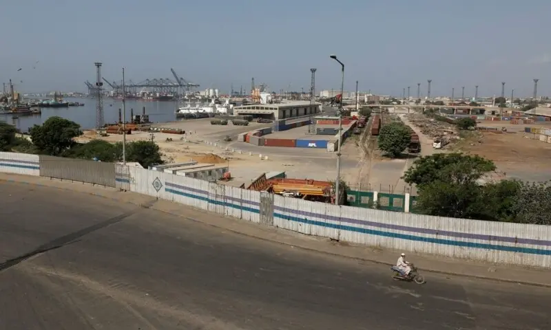 A man on a motorbike rides with the Karachi Port in the background, during a shutter down and wheel-jam strike in Karachi on September 2, 2023. — Reuters A man on a motorbike rides with the Karachi Port in the background, during a shutter down and wheel-jam strike in Karachi on September 2, 2023. — Reuters
