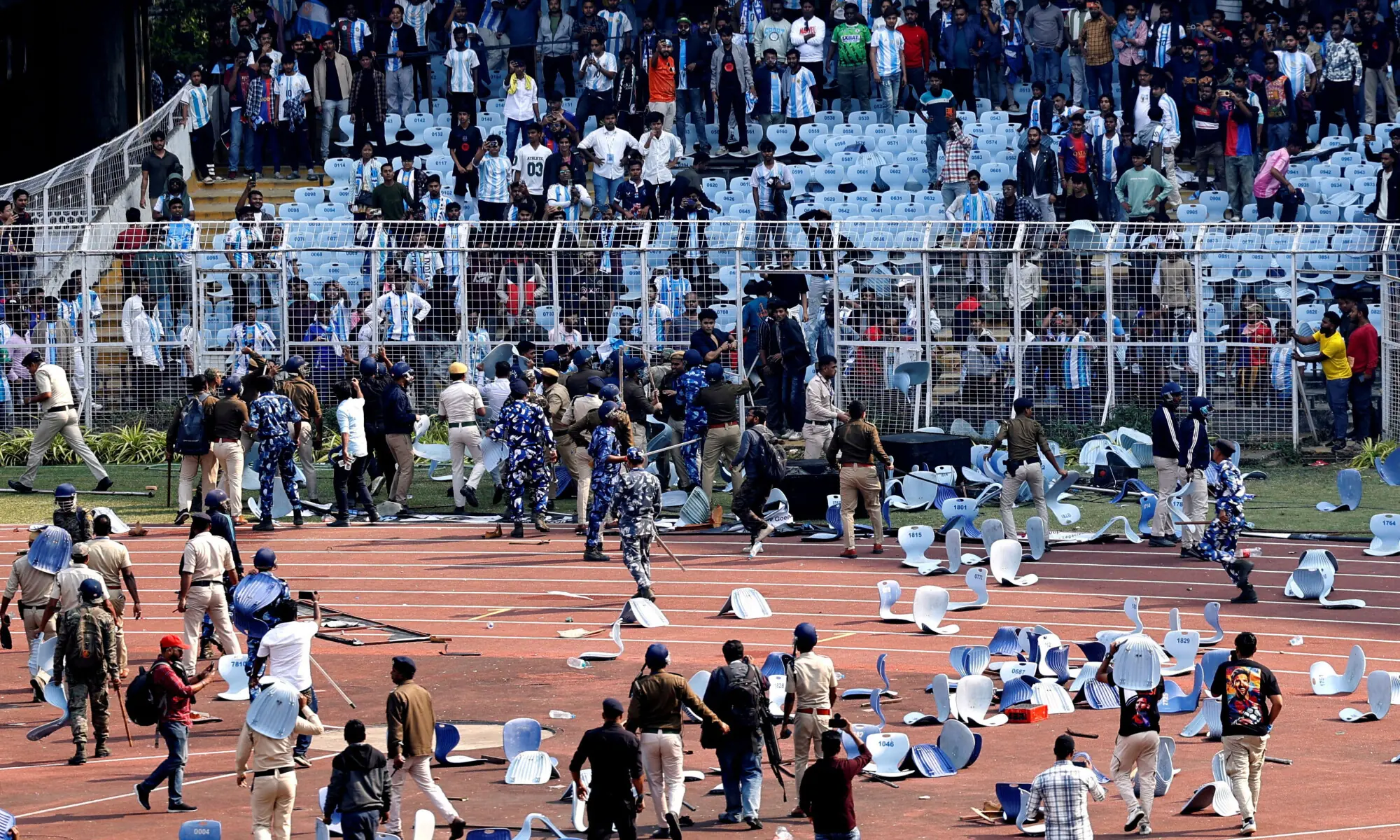 Police and security clash with fans after Argentine soccer star Lionel Messi left the Salt Lake Stadium in Kolkata during his whirlwind tour of India on December 13, 2025.&mdash;Reuters