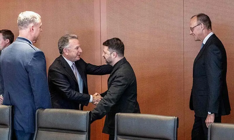 This handout photo released on December 14 by the German government&rsquo;s press service shows German Chancellor Friedrich Merz (R) watching as US special envoy Steve Witkoff (2ndL) and Ukraine&rsquo;s President Volodymyr Zelensky greet each other prior to a meeting in a conference room in the Chancellery in Berlin, Germany on December 14. &mdash; AFP