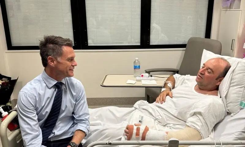 New South Wales Premier Chris Minns visits Ahmed al Ahmed, who was identified on social media as the bystander who seized a rifle from one of the gunmen during the deadly shooting at Bondi Beach on Sunday, at a hospital in Sydney, Australia on December 15. &mdash; Reuters