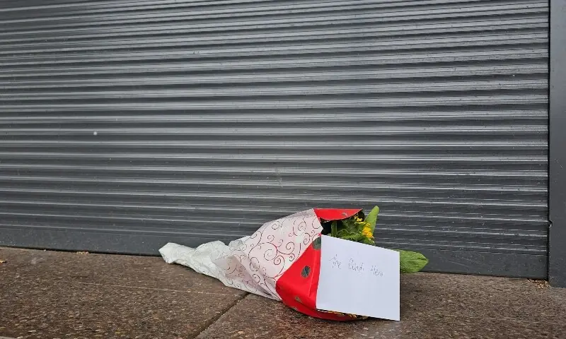 Flowers with a note that read &ldquo;The Bondi Hero&rdquo; are left outside tobacco shop owned by Ahmed al Ahmed, the bystander who is hailed as the &ldquo;Bondi hero&rdquo;, in Sydney, Australia, December 16, 2025. &mdash;Reuters