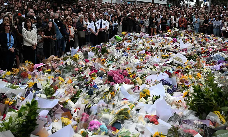 Mourners gather at a tribute at the Bondi Pavilion in memory of the victims of a shooting at Bondi Beach, in Sydney on December 16, 2025. Australia&rsquo;s leaders have agreed to toughen gun laws after attackers killed 15 people at a Jewish festival on Bondi Beach, the worst mass shooting in decades decried as antisemitic &ldquo;terrorism&rdquo; by authorities. (Photo by Saeed KHAN / AFP)