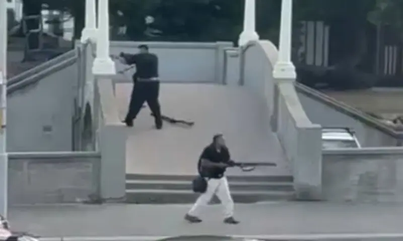This screenshot shows Sajid Akram and his son, Naveed Akram, targeting people during a mass shooting at Bondi Beach in Sydney, Australia on December 14. &mdash; Photo courtesy ABC Australia