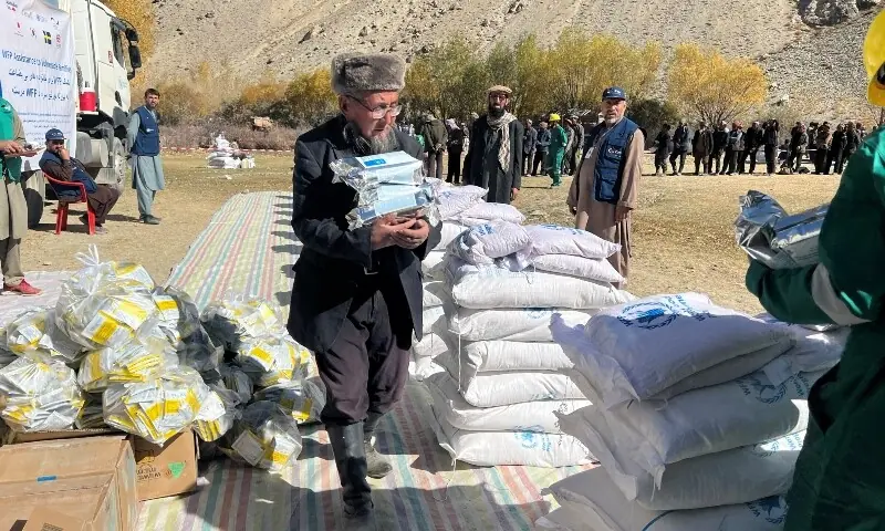 A man carries food packets that he received at a World Food Programme (WFP) distribution site in Wakhan district in Badakhshan province, Afghanistan on October 24. — Reuters A man carries food packets that he received at a World Food Programme (WFP) distribution site in Wakhan district in Badakhshan province, Afghanistan on October 24. — Reuters