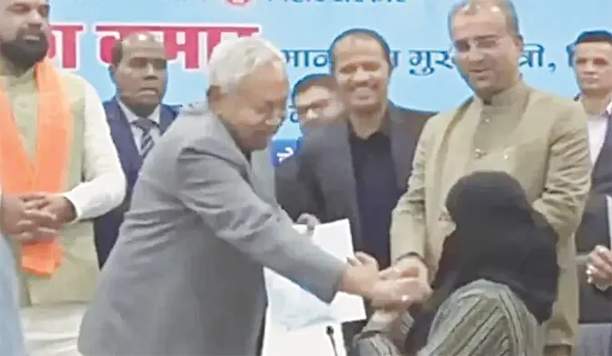 A screengrab from a viral video shows Bihar CM Nitish Kumar pulling down the veil of a doctor, who came to receive a certificate. &mdash; File photo