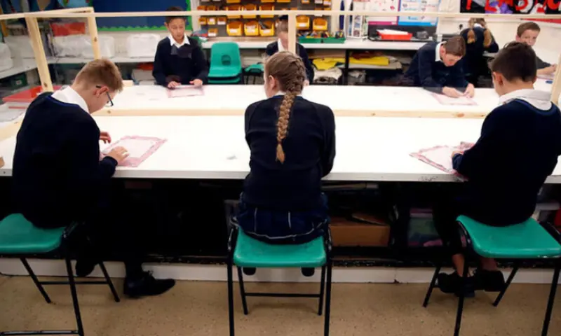 Children sit in a classroom at Heath Mount in Watton at Stone, the UK. &mdash; Reuters/File