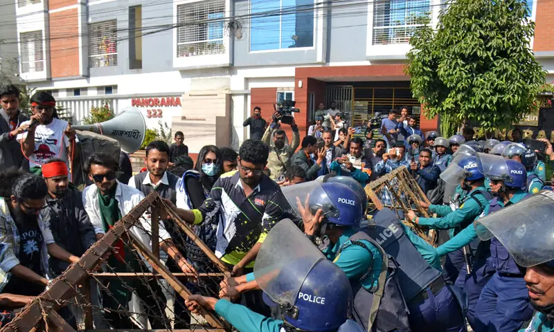 Bangladeshi police try to stop demonstrators as they march towards the assistant Indian high commissioner office in Rajshahi on December 18. &mdash; AFP