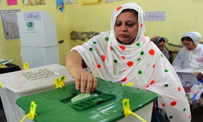 In this file photo, a woman casts her vote at a polling station in Gulbahar, Peshawar. &mdash; Ghulam Dastageer