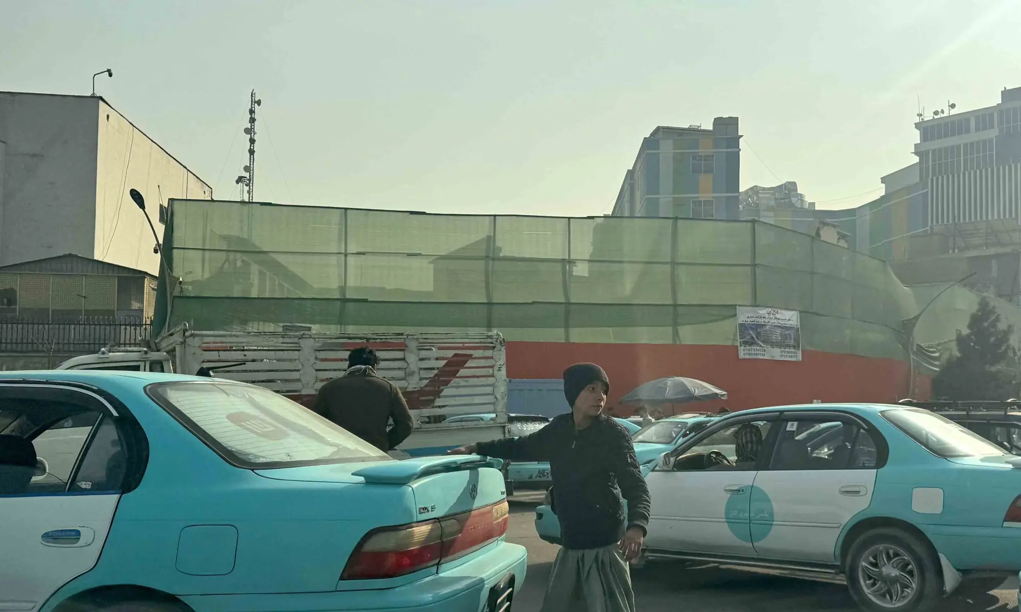 Cars drive past as the Taliban demolish the historical Ariana cinema in Kabul on December 18, 2025. — AFP Cars drive past as the Taliban demolish the historical Ariana cinema in Kabul on December 18, 2025. — AFP