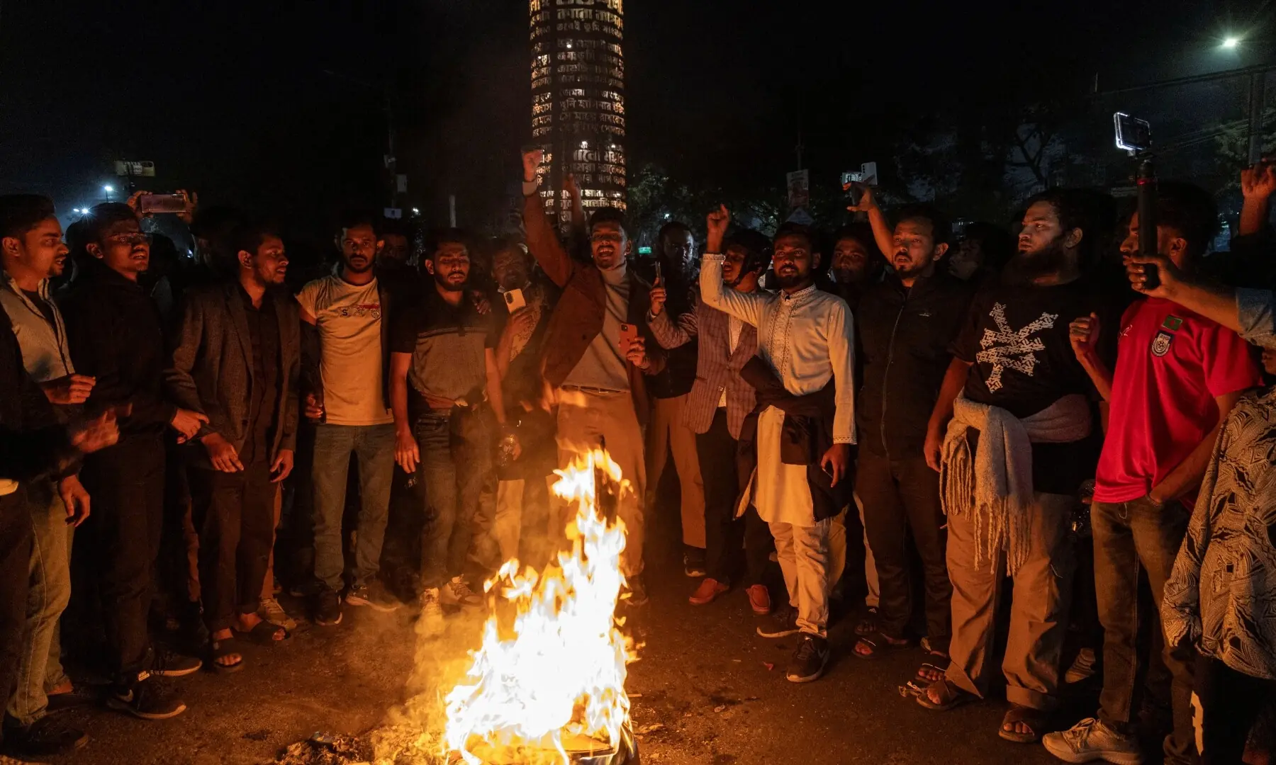 People shout slogans following the death of Sharif Osman Hadi, a student leader who had been receiving treatment in Singapore after being shot in the head, in Dhaka, Bangladesh, December 18, 2025. &mdash; Reuters