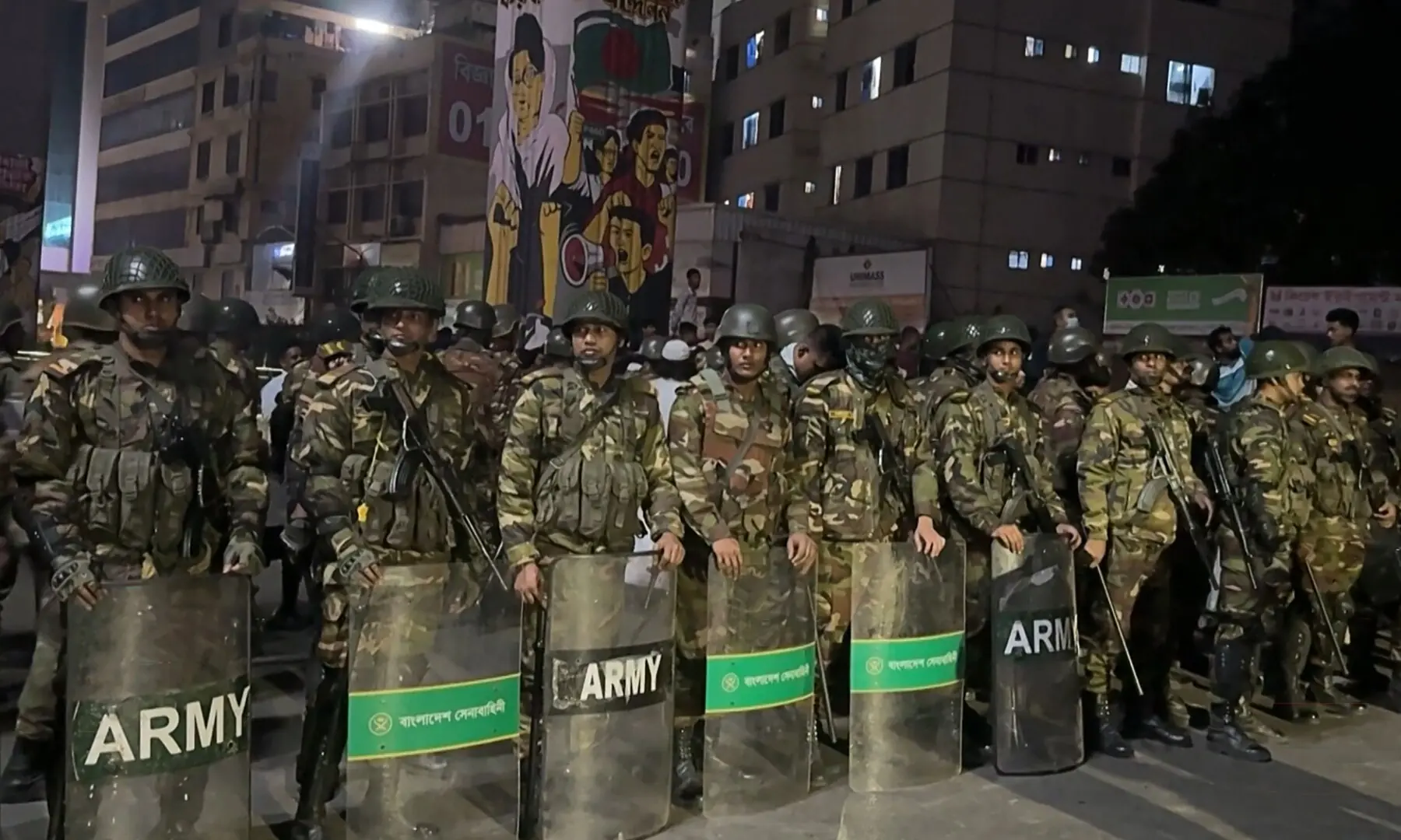 This frame grab from AFPTV video footage taken on December 19, 2025 shows military personnel standing guard in Dhaka, amid protests following the news of the death of youth leader Sharif Osman Hadi. &mdash;  AFP