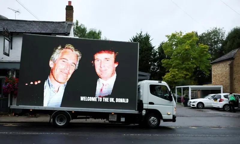 An image of US President Donald Trump alongside disgraced financier Jeffrey Epstein is displayed on a vehicle on the day of the state visit of the US President and first lady Melania Trump, in Windsor, Britain, September 17. — Reuters An image of US President Donald Trump alongside disgraced financier Jeffrey Epstein is displayed on a vehicle on the day of the state visit of the US President and first lady Melania Trump, in Windsor, Britain, September 17. — Reuters