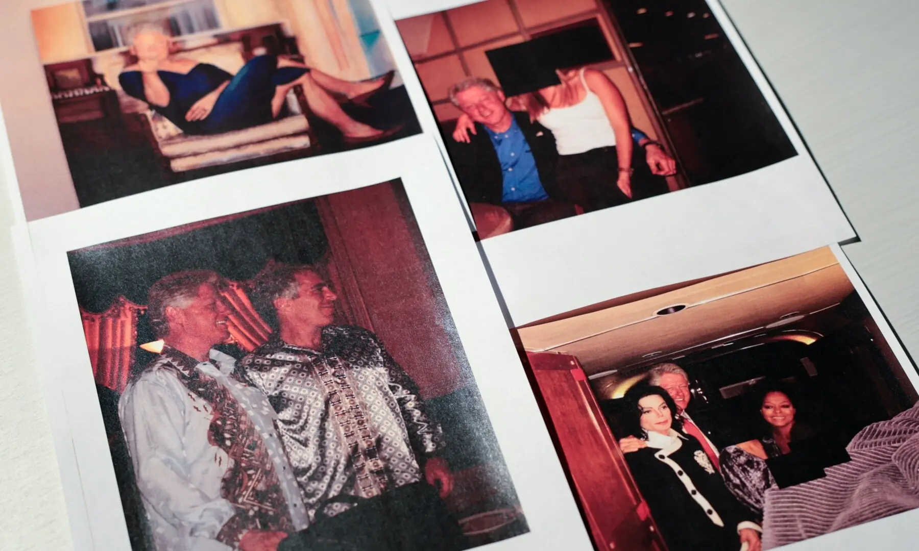 Newly-released documents from late financier and sex offender Jeffrey Epstein, including a number of pictures of former US President Bill Clinton and a photo of a painting depicting Clinton in a blue dress, are seen in these handout images released by the U.S. Justice Department and printed and arranged for a photograph by Reuters in Washington, DC, US on December 19, 2025. &mdash;Reuters