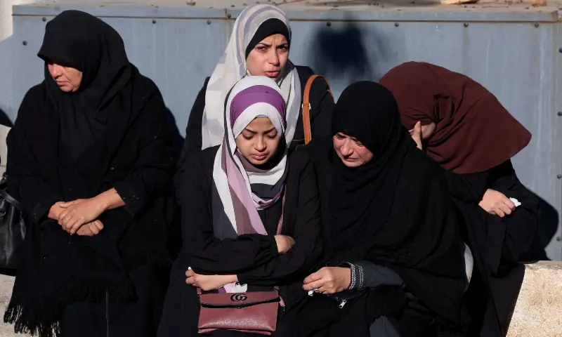 Mourners react during the funeral of Palestinians killed in an Israeli strike on Friday, according to medics, at Al-Shifa Hospital in Gaza City on December 20, 2025. &mdash; Reuters