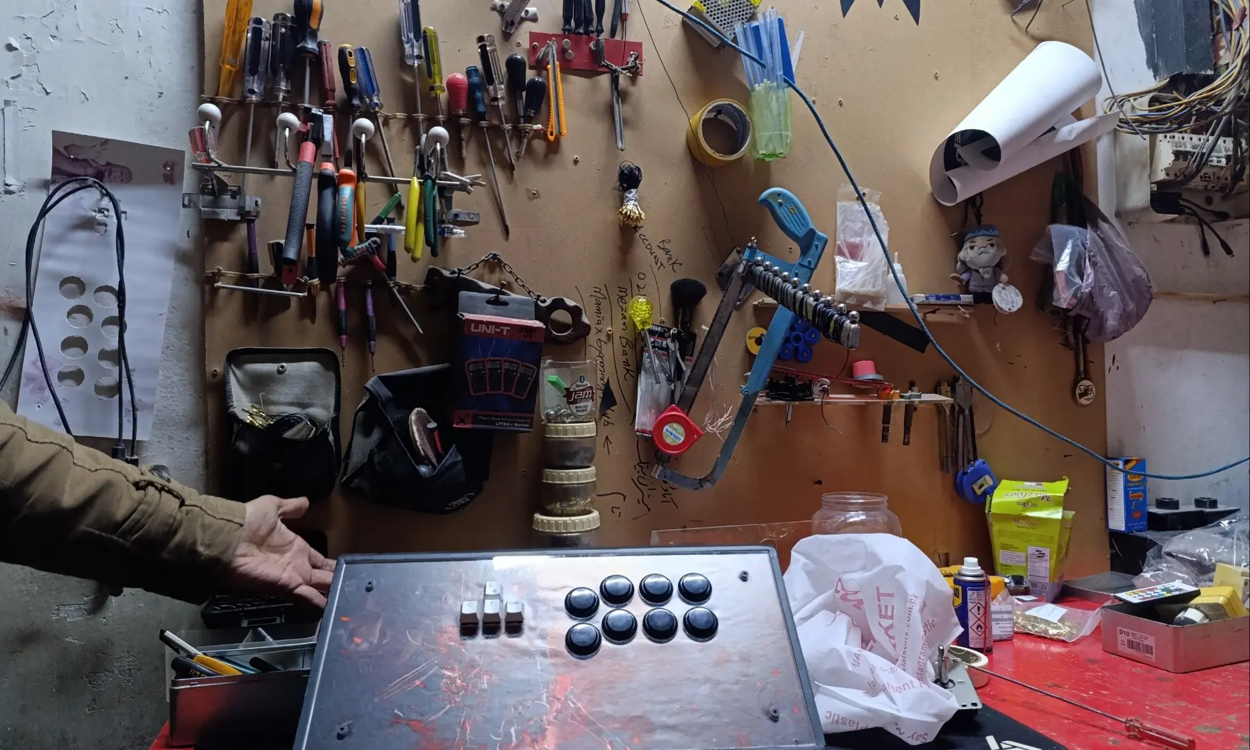 Zamin Abbas builds his own custom joysticks in a small workshop at Maniax Gaming. &mdash; author