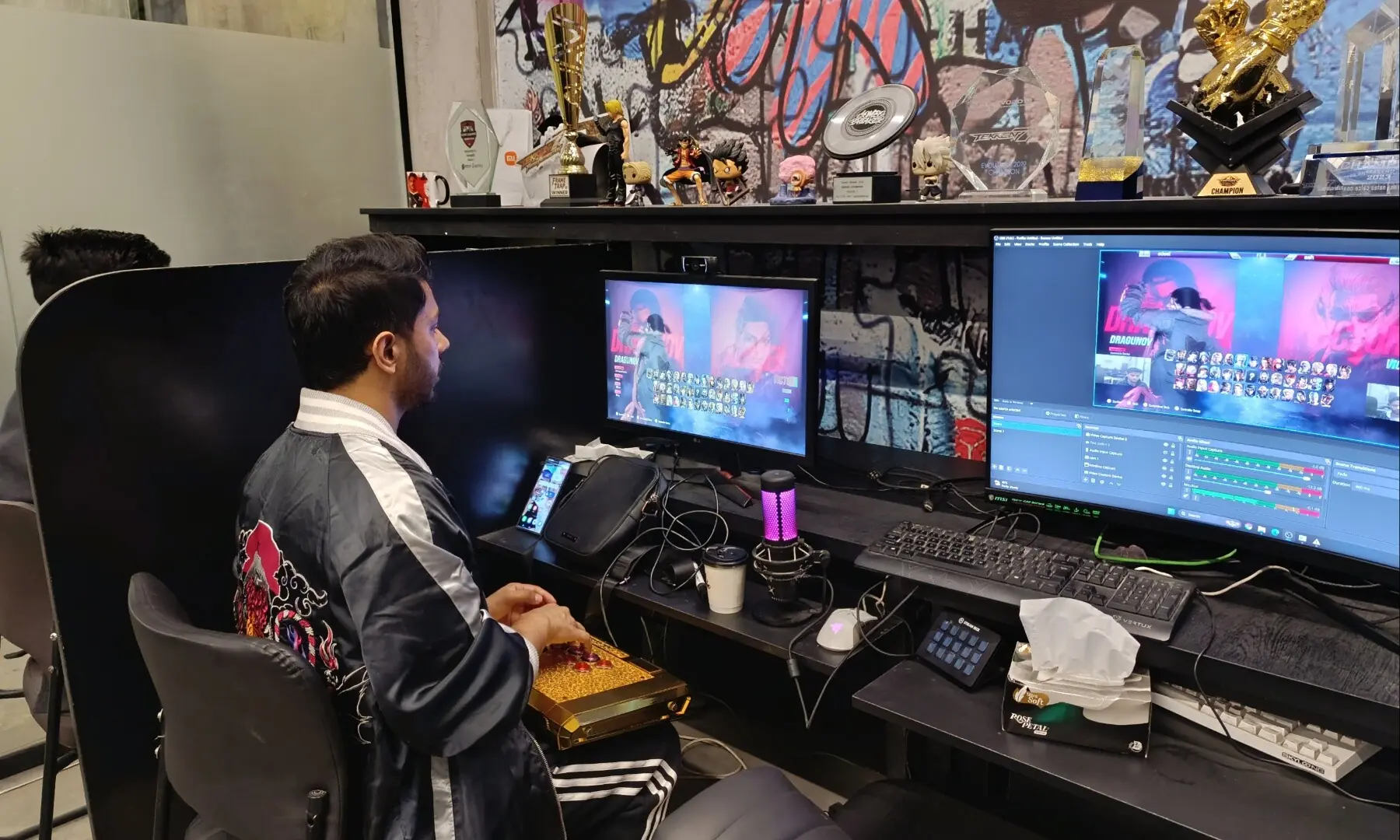 Arslan playing Tekken in his practice room he built with the support of friends in Lahore. &mdash; author
