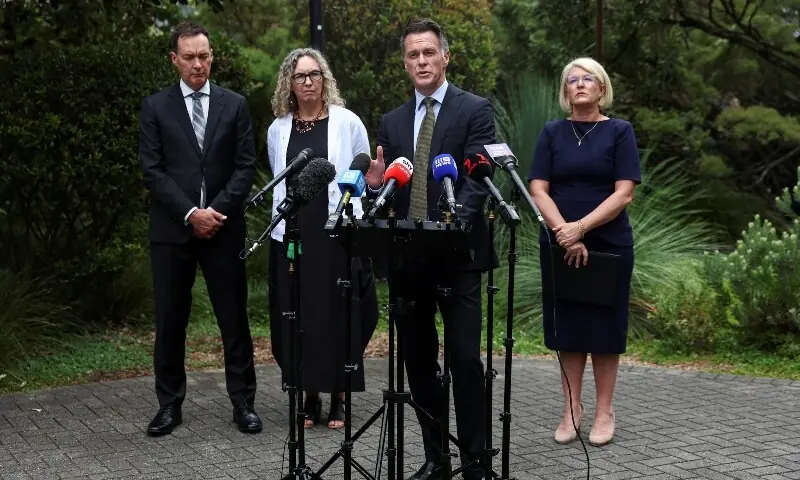 New South Wales Premier Chris Minns speaks during a press conference to give an update on the deadly shooting at Bondi Beach, with Minister for Police and Counter-terrorism Yasmin Catley, and Stephen Bendle, the convener of the Australian Gun Safety Alliance (AGSA), at the NSW Parliament, in Sydney, Australia, December 22. &mdash; AFP