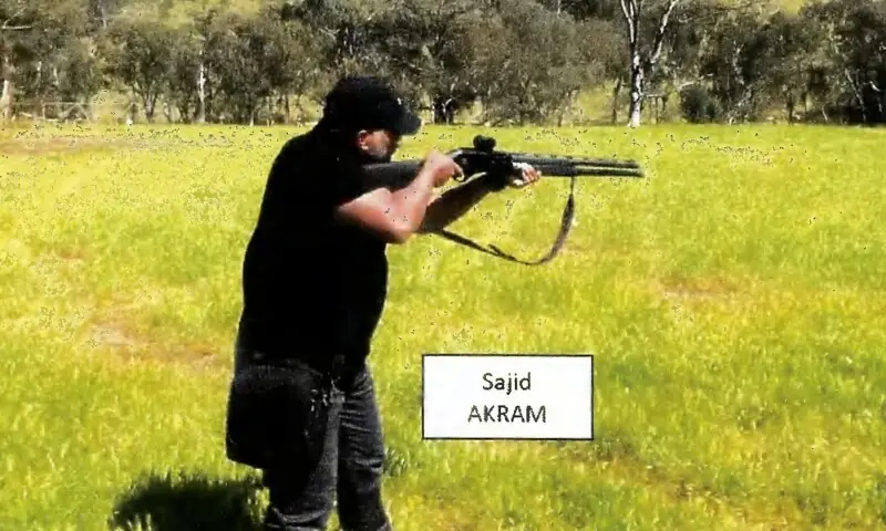This handout photo from a court exhibit released by the NSW Courts on December 22, shows a frame grab taken from a video recorded in late October of Sajid Akram allegedly firing a shotgun and moving in a tactical manner in a countryside location, suspected to be in New South Wales. &mdash; AFP