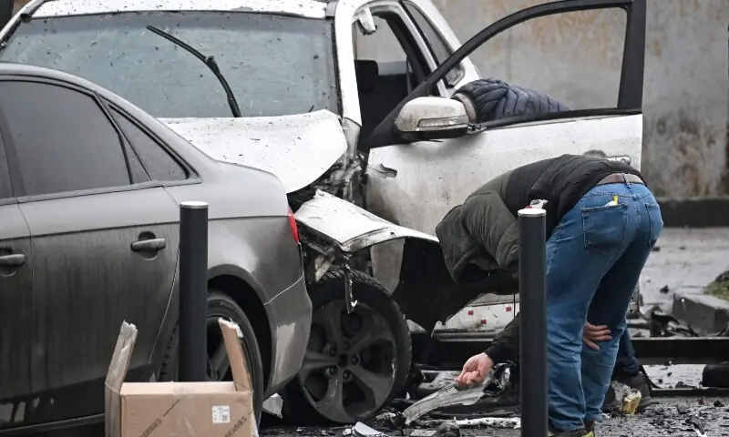 Investigators work at the car blast site in southern Moscow on December 22, 2025. —AFP