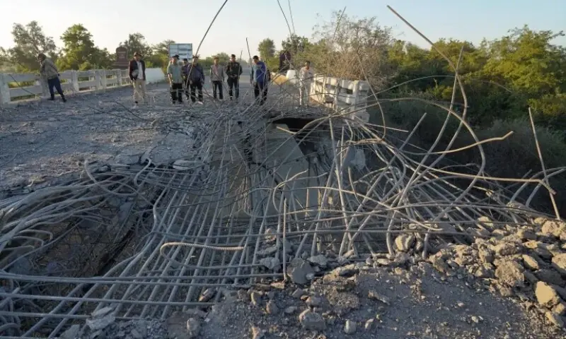People look at a damaged bridge after Thailand carried out air strikes in an area between Cambodia&rsquo;s Oddar Meanchey and Siem Reap provinces on December 20, 2025. &mdash;AFP/File