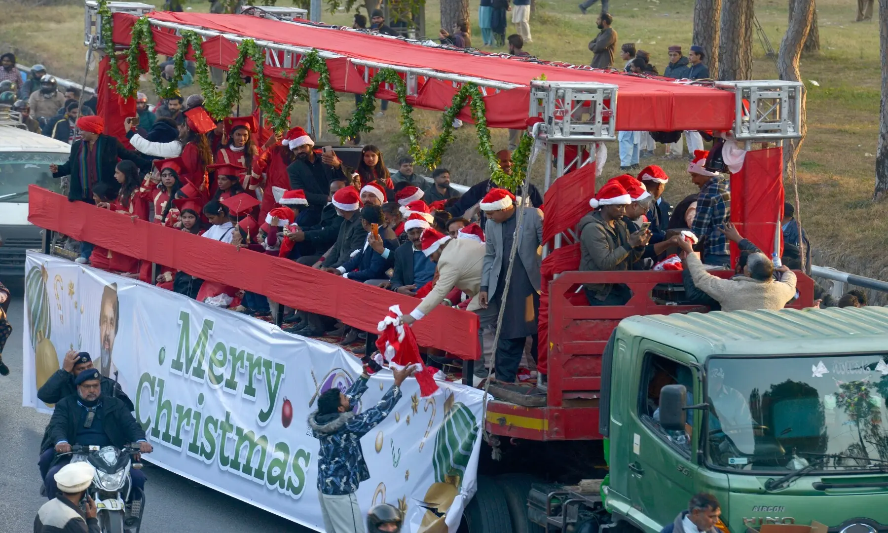 Christmas Aman Rally passes through Faisal Avenue as it heads towards the National Press Club in Islamabad. The rally was organised by United Council of Churches. &mdash; Mohammad Asim/White Star