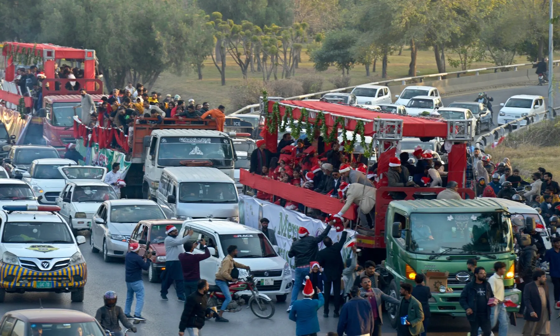 Christmas Aman Rally passes through Faisal Avenue as it heads towards the National Press Club in Islamabad. The rally was organised by United Council of Churches.  &mdash; Mohammad Asim/White Star