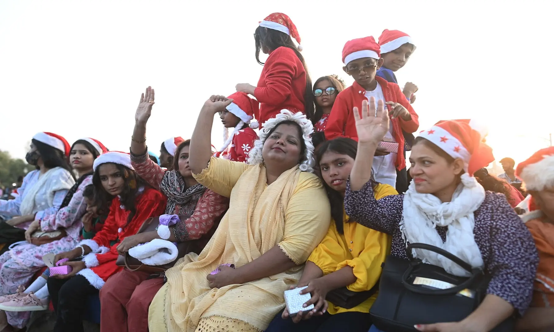 Members of the Pakistani Christian minority parade ahead of Christmas on a road in Karachi. &mdash; Shakil Adil White Star