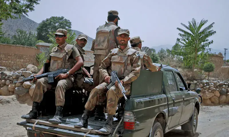 A file photo of Pakistan Army personnel in the back of a military vehicle. &mdash; Reuters/File