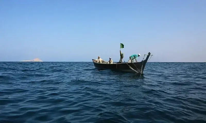 A fishing boat with fishermen floats on open waters under a clear blue sky. —Dawn/File Photo A fishing boat with fishermen floats on open waters under a clear blue sky. —Dawn/File Photo