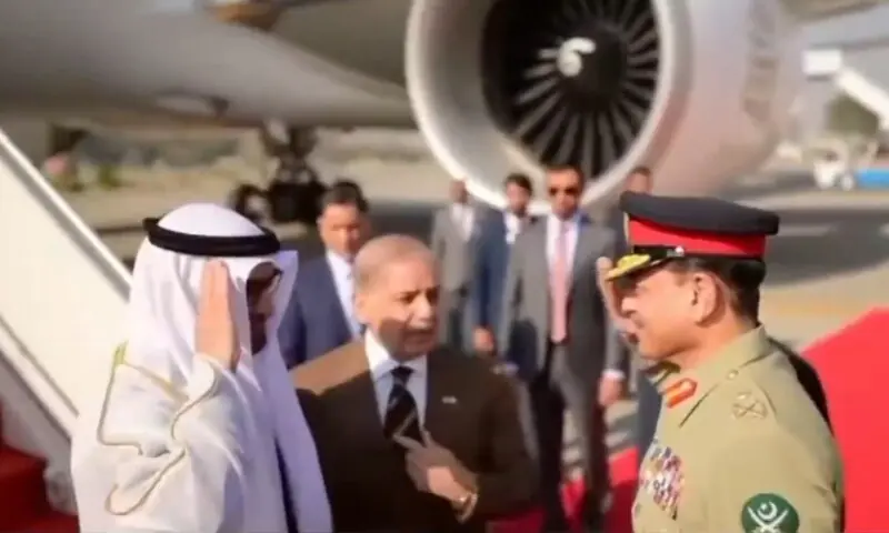 Chief of Defence Forces and Chief of Army Staff Field Marshal Asim Munir greets the Emirati president upon his arrival at Nur Khan airbase on December 26. &mdash; DawnNewsTV