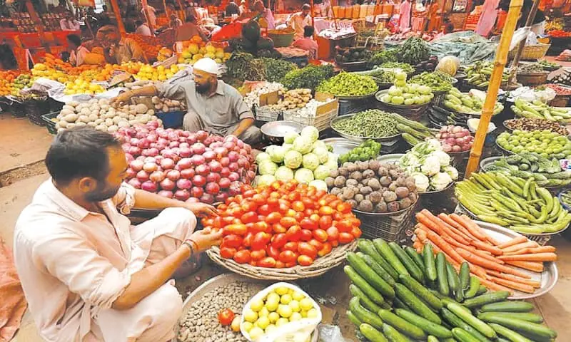 A man is seen selling vegetables in this file photo. — Reuters/File A man is seen selling vegetables in this file photo. — Reuters/File