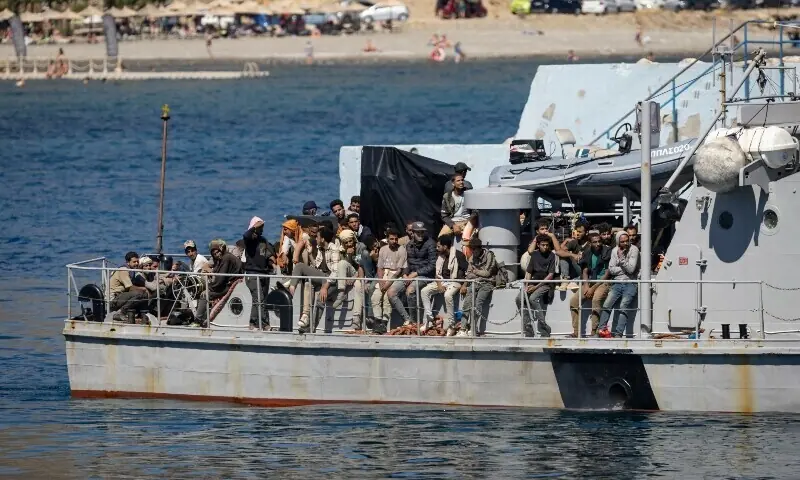 This file photo shows migrants rescued at sea off the Greek island of Crete stand on a Greek coast guard vessel to be transferred from the port of Agia Galini on July 6. — AFP This file photo shows migrants rescued at sea off the Greek island of Crete stand on a Greek coast guard vessel to be transferred from the port of Agia Galini on July 6. — AFP