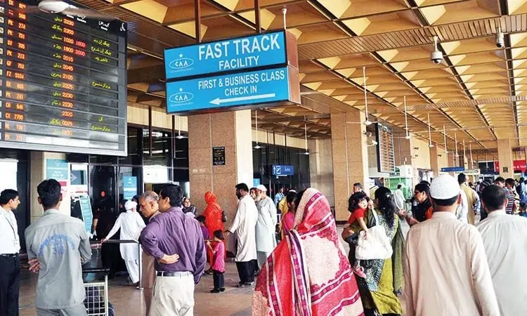 A file photo showing Pakistanis at an airport. — AFP/File A file photo showing Pakistanis at an airport. — AFP/File
