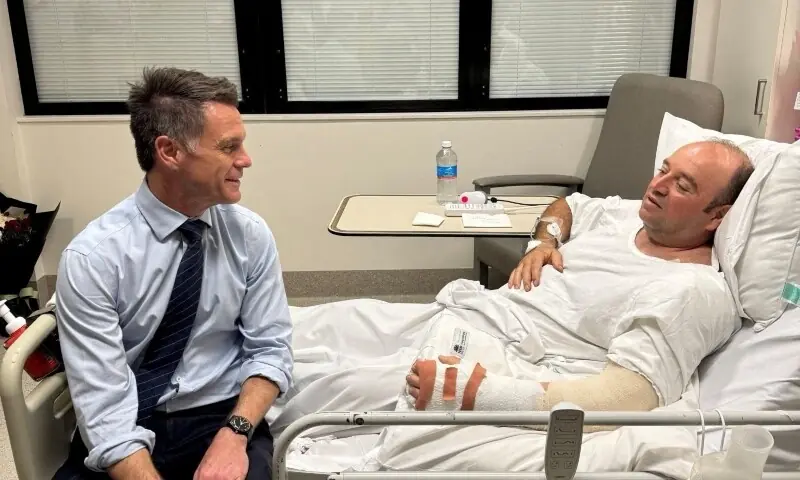 New South Wales Premier Chris Minns visits Ahmed al Ahmed, who was identified on social media as the bystander who hid behind parked cars and seized a rifle from one of the gunmen during the deadly shooting at Bondi Beach at a hospital in Sydney, Australia on December 15. &mdash; Reuters