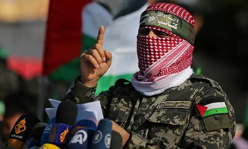 Abu Obeida, the spokesman of the Izz el-Deen al-Qassam Brigades, gestures as he speaks during an anti-Israel military show in the southern Gaza Strip on November 11, 2019. &mdash; Reuters/File