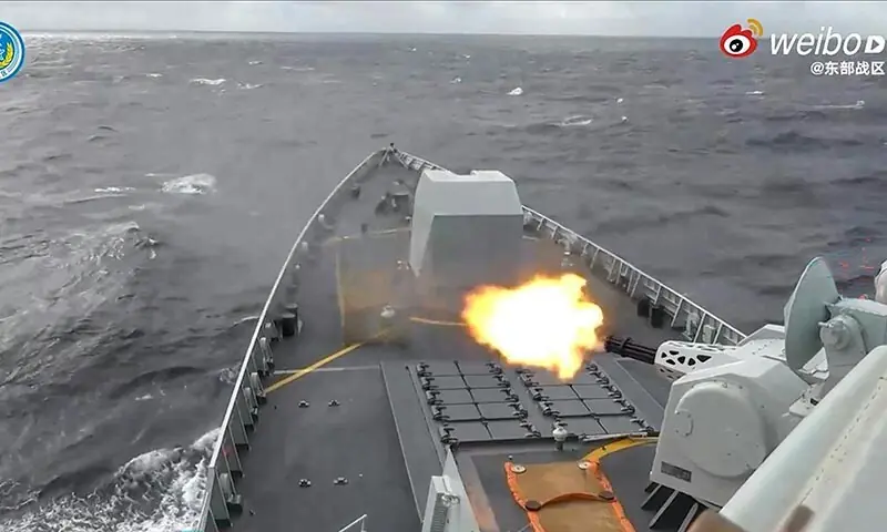 This frame grab from an undated handout video issued by China&rsquo;s People&rsquo;s Liberation Army (PLA) Eastern Theatre Command on December 29 shows a Chinese warship shooting in an undisclosed location. &mdash; AFP