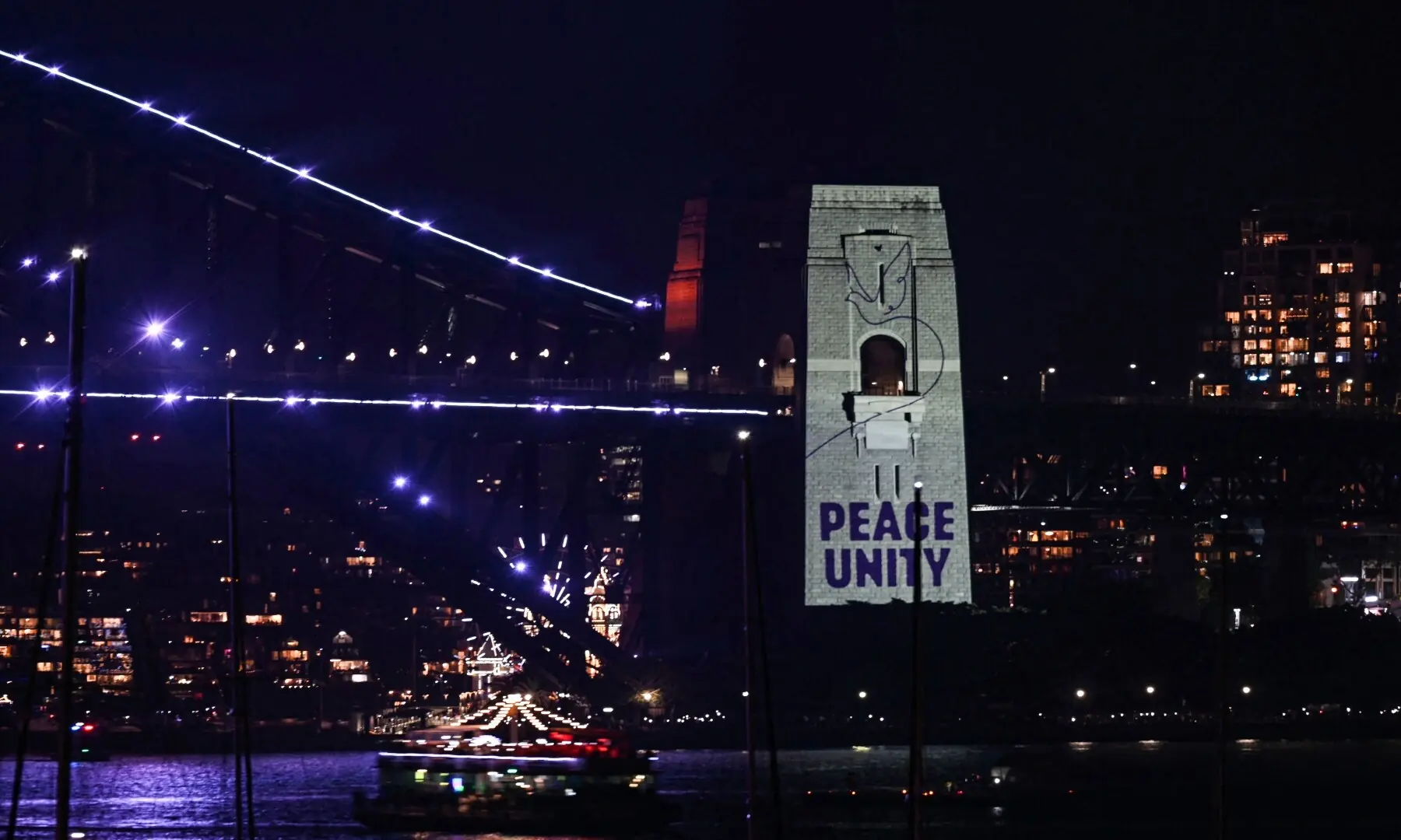 A message reading &ldquo;Peace, Unity&rdquo; is displayed on the pylon of the Sydney Harbour Bridge to reflect on the tragic Bondi Beach shooting attack before New Year&rsquo;s Eve midnight fireworks display in Sydney on December 31, 2025. . &mdash; Saeed Khan / AFP