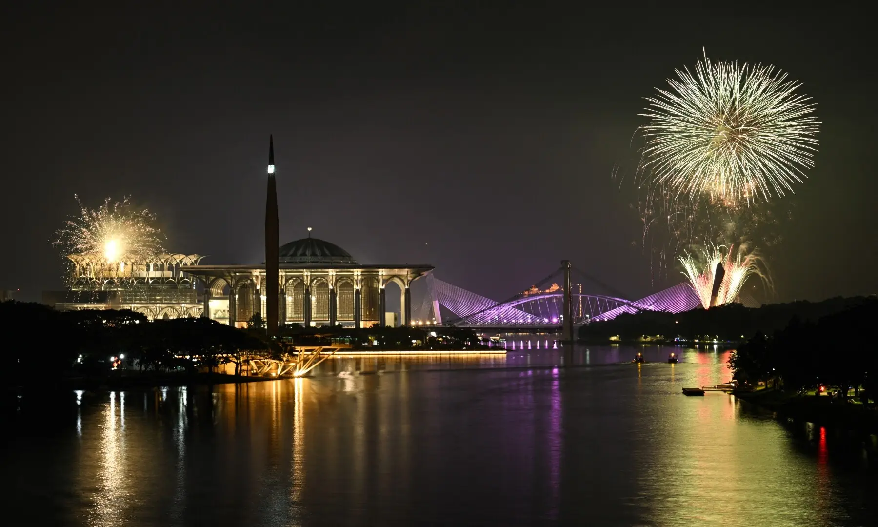 Fireworks light up the midnight sky over the Tuanku Mizan Zainal Abidin Mosque and Seri Saujana Bridge during New Year&rsquo;s Day celebrations in Putrajaya on January 1, 2026. &mdash; Mohd Rasfan / AFP