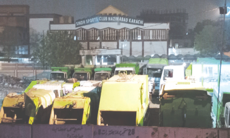 GARBAGE trucks parked just outside the premises of the Sindh Sports Board Club on Sunday.&mdash;Mohammad Asim Rehman