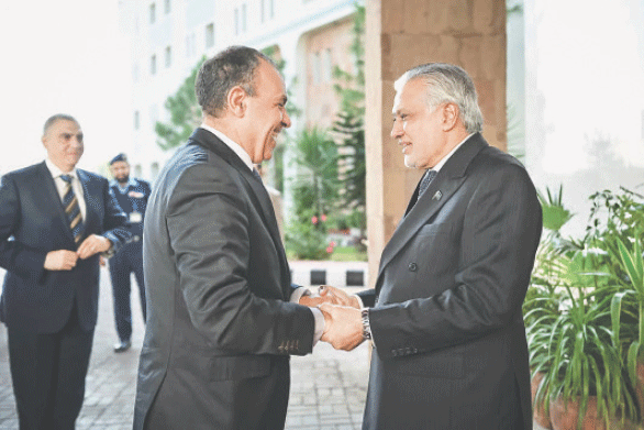ISLAMABAD: Foreign Minister Ishaq Dar greets his Egyptian counterpart Badr Abdelatty.&mdash;AFP