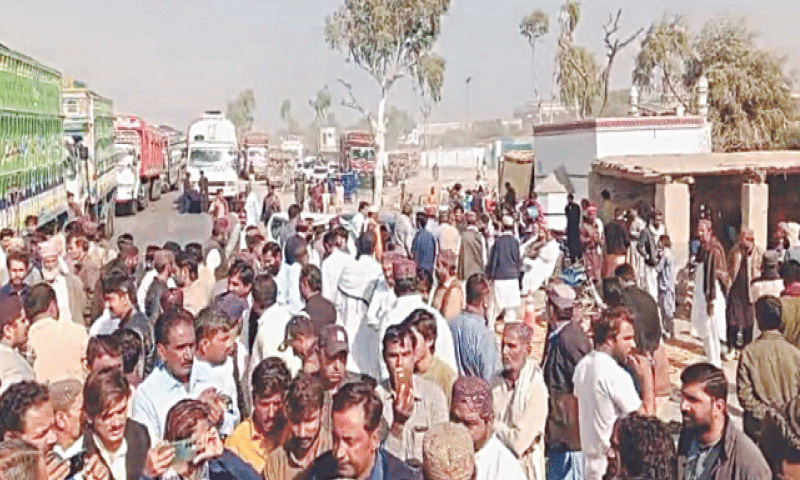PROTESTERS gather outside a sugar mill in Obauro taluka of Ghotki district before holding a sit-in on Tuesday.&mdash;Dawn