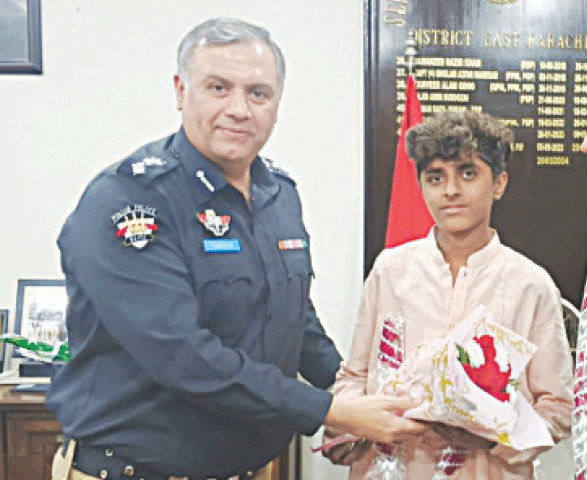  The SSP East presents a bouquet to Tanveer.-Dawn
