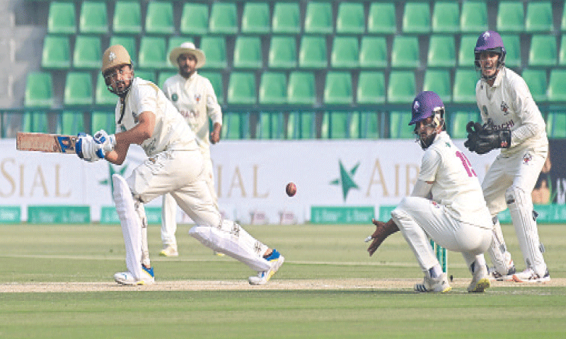 LAHORE: Sialkot batter Hamza Nazar plays a shot during the Quaid-e-Azam Trophy final against Karachi Blues at the Gaddafi Stadium on Tuesday.—Courtesy PCB LAHORE: Sialkot batter Hamza Nazar plays a shot during the Quaid-e-Azam Trophy final against Karachi Blues at the Gaddafi Stadium on Tuesday.—Courtesy PCB