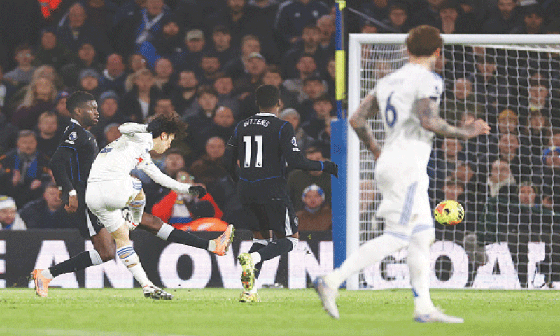 LEEDS: Ao Tanaka (second L) of Leeds United shoots to score against Chelsea during their Premier League match at Elland Road.—Reuters