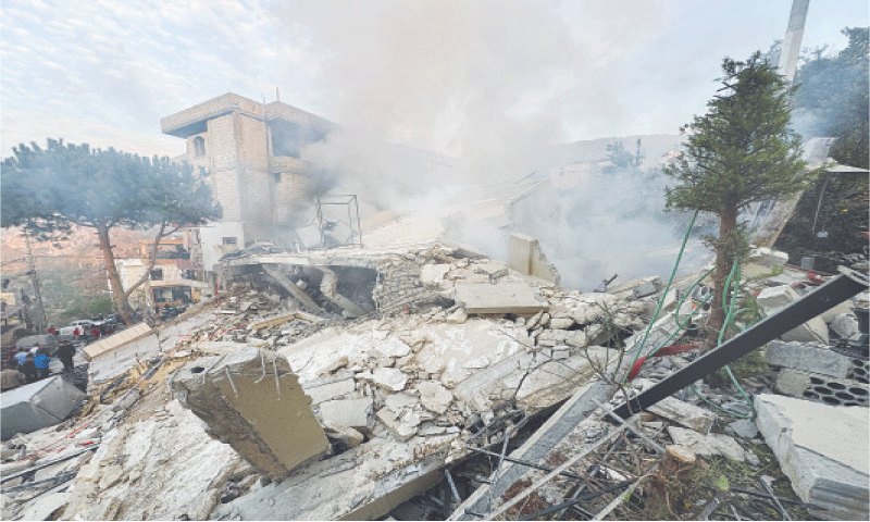 People inspect a damaged site after Israel’s military struck targets in two southern Lebanese towns.—Reuters People inspect a damaged site after Israel’s military struck targets in two southern Lebanese towns.—Reuters