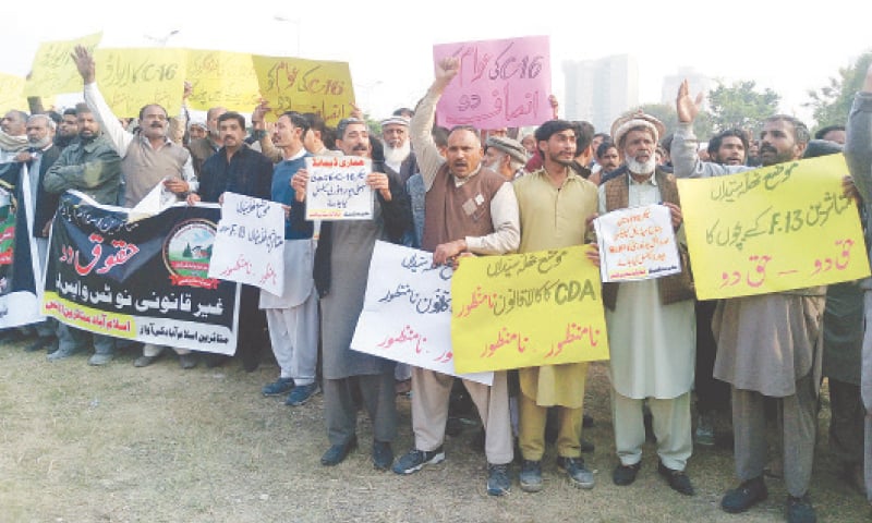 Landowners protest against CDA outside the National Press Club in Islamabad on Thursday. &mdash; White Star