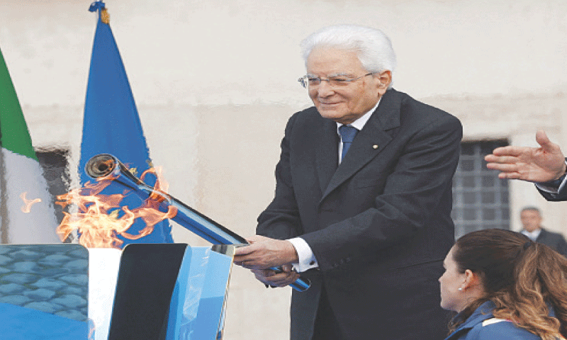 ROME: Italian President Sergio Mattarella lights the torch during a ceremony for the 2026 Milano-Cortina Winter Olympics flame on Friday.—Reuters ROME: Italian President Sergio Mattarella lights the torch during a ceremony for the 2026 Milano-Cortina Winter Olympics flame on Friday.—Reuters
