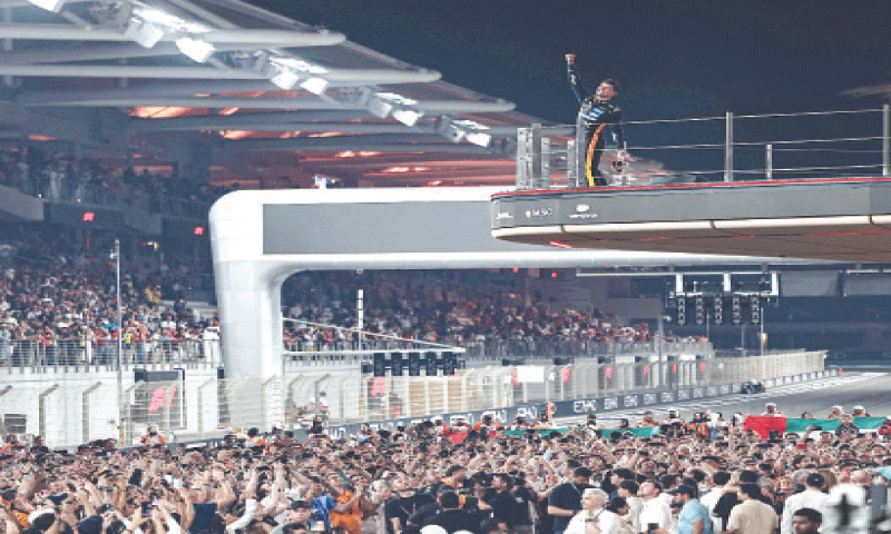ABU DHABI: McLaren’s British driver Lando Norris celebrates with the trophy at the end of the Abu Dhabi F1 Grand Prix at the Yas Marina Circuit on Sunday.—AFP ABU DHABI: McLaren’s British driver Lando Norris celebrates with the trophy at the end of the Abu Dhabi F1 Grand Prix at the Yas Marina Circuit on Sunday.—AFP
