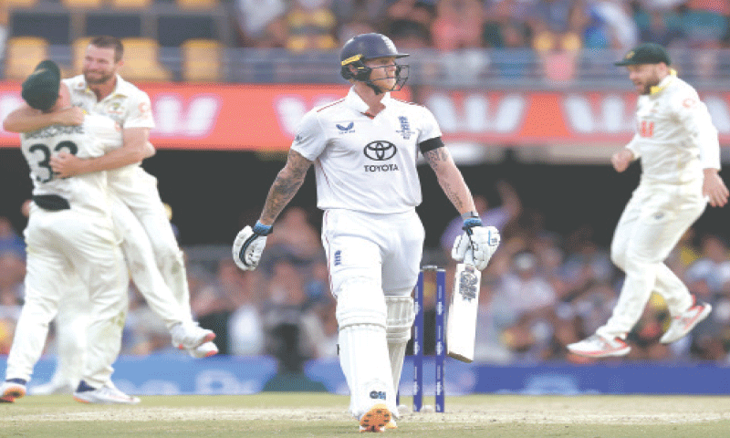 BRISBANE: Australian pacer Michael Neser (second L) celebrates with team-mates after dismissing England captain Ben Stokes during the second Ashes Test at the Gabba on Sunday.&mdash;AFP